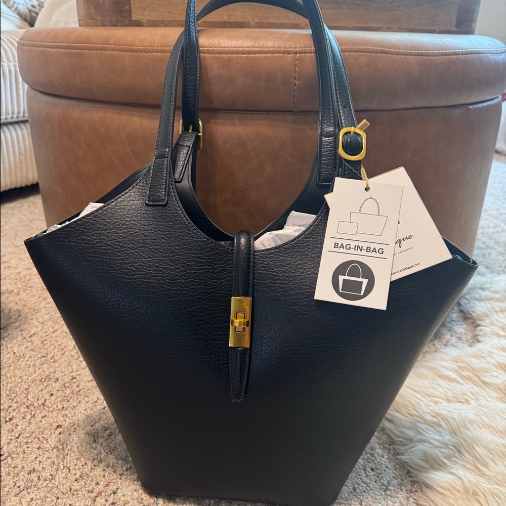Miztique Black leather tote bag with gold hardware. Compartment bag.
